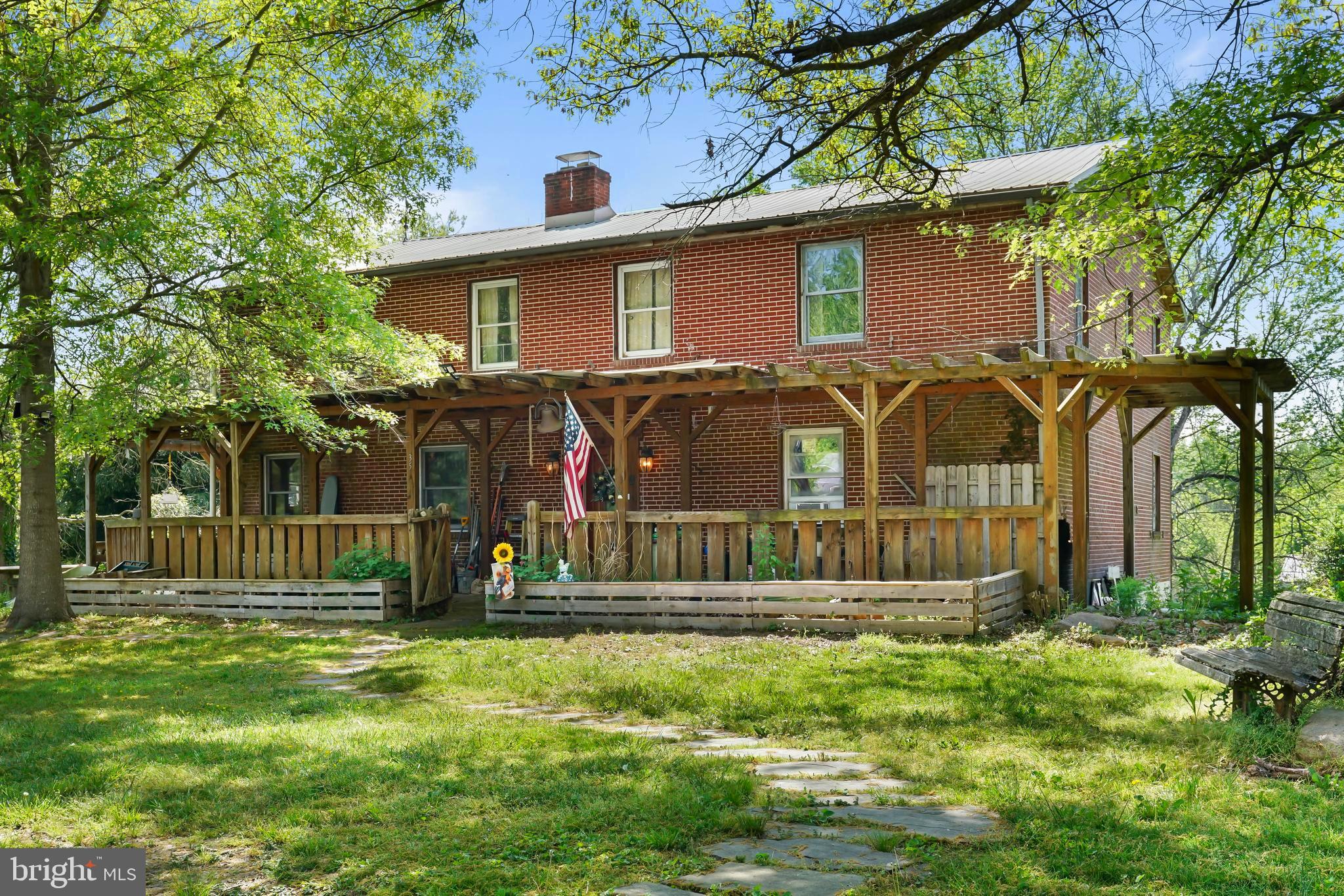 a view of a house with a small yard