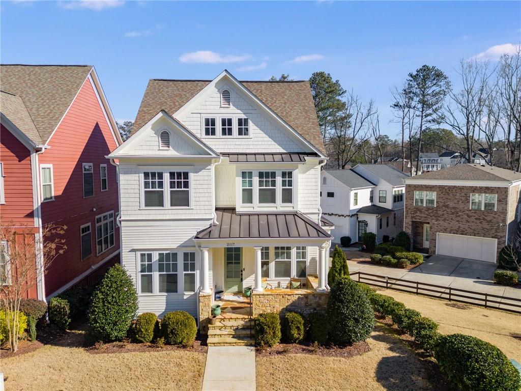 a front view of a residential apartment building with a yard