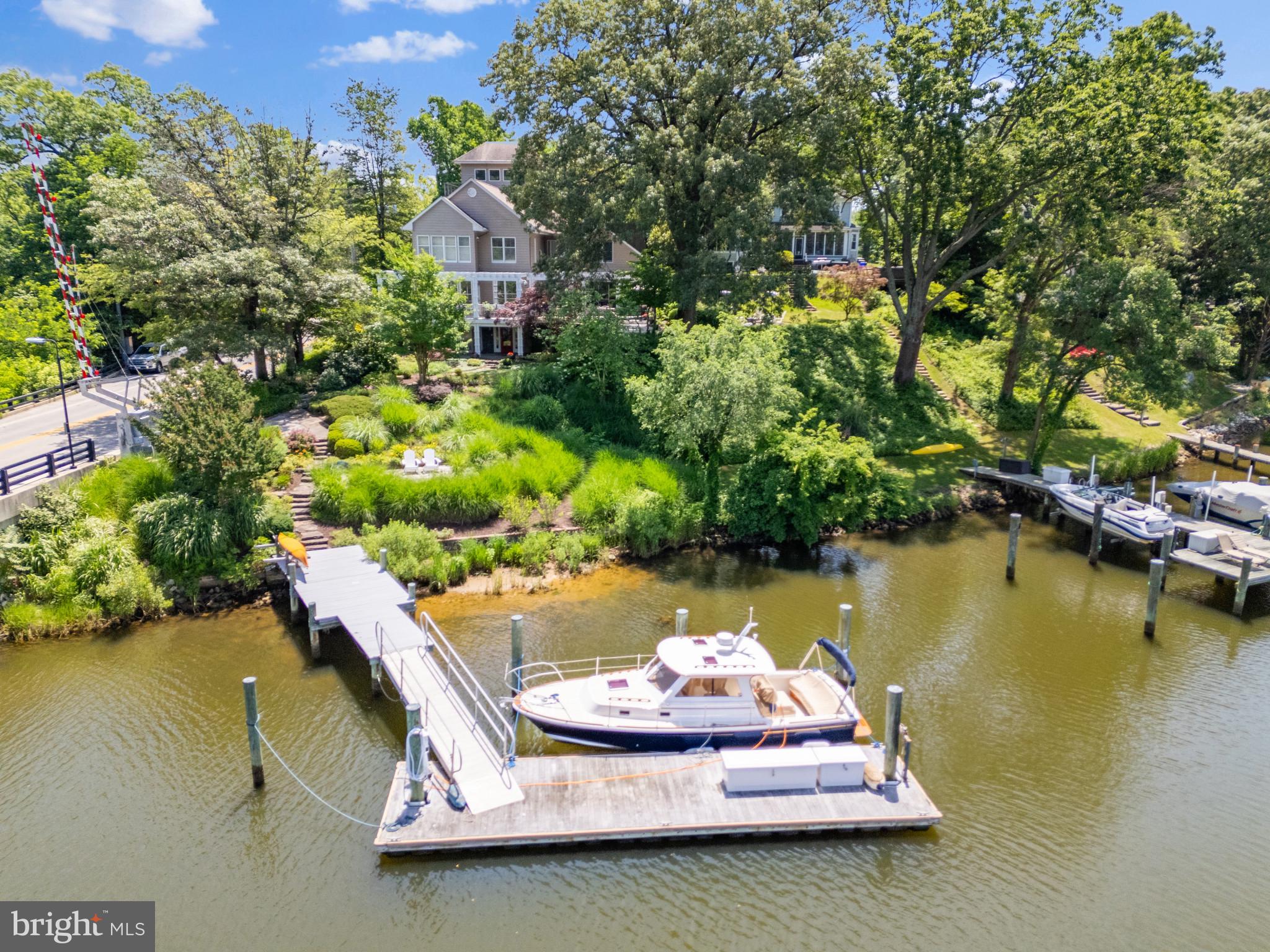 an aerial view of a house with a yard lake view