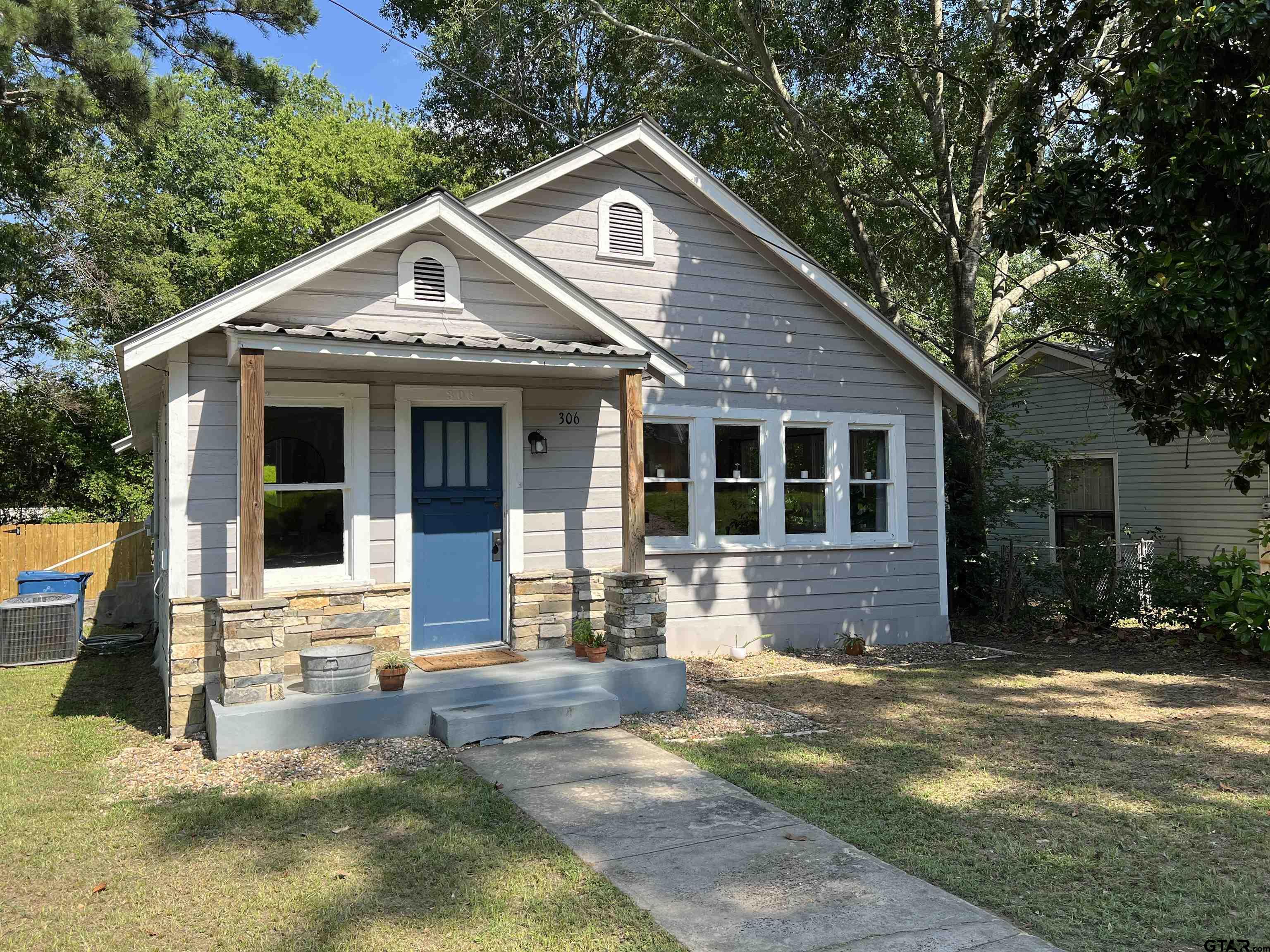 a front view of a house with yard