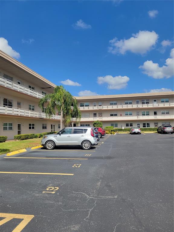 a view of parking with cars parked