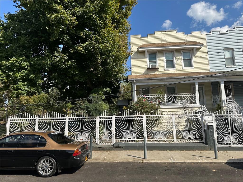 a front view of a house with parking