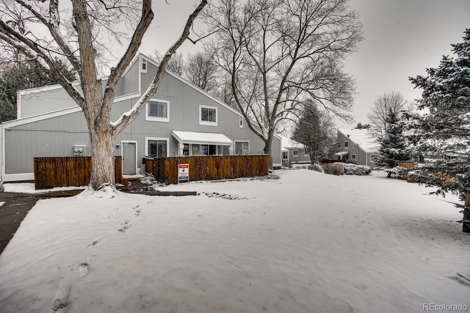 a view of a house with snow on the road