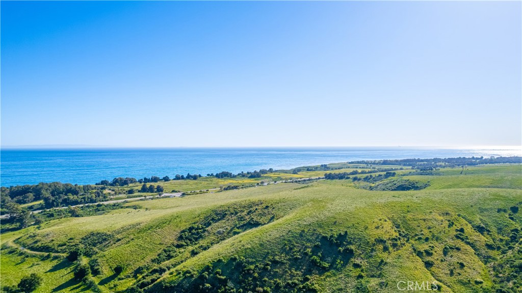 a view of an ocean and a mountain