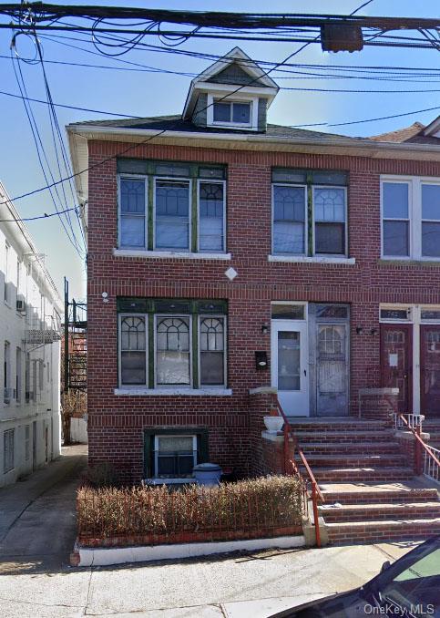 a front view of a house with stairs