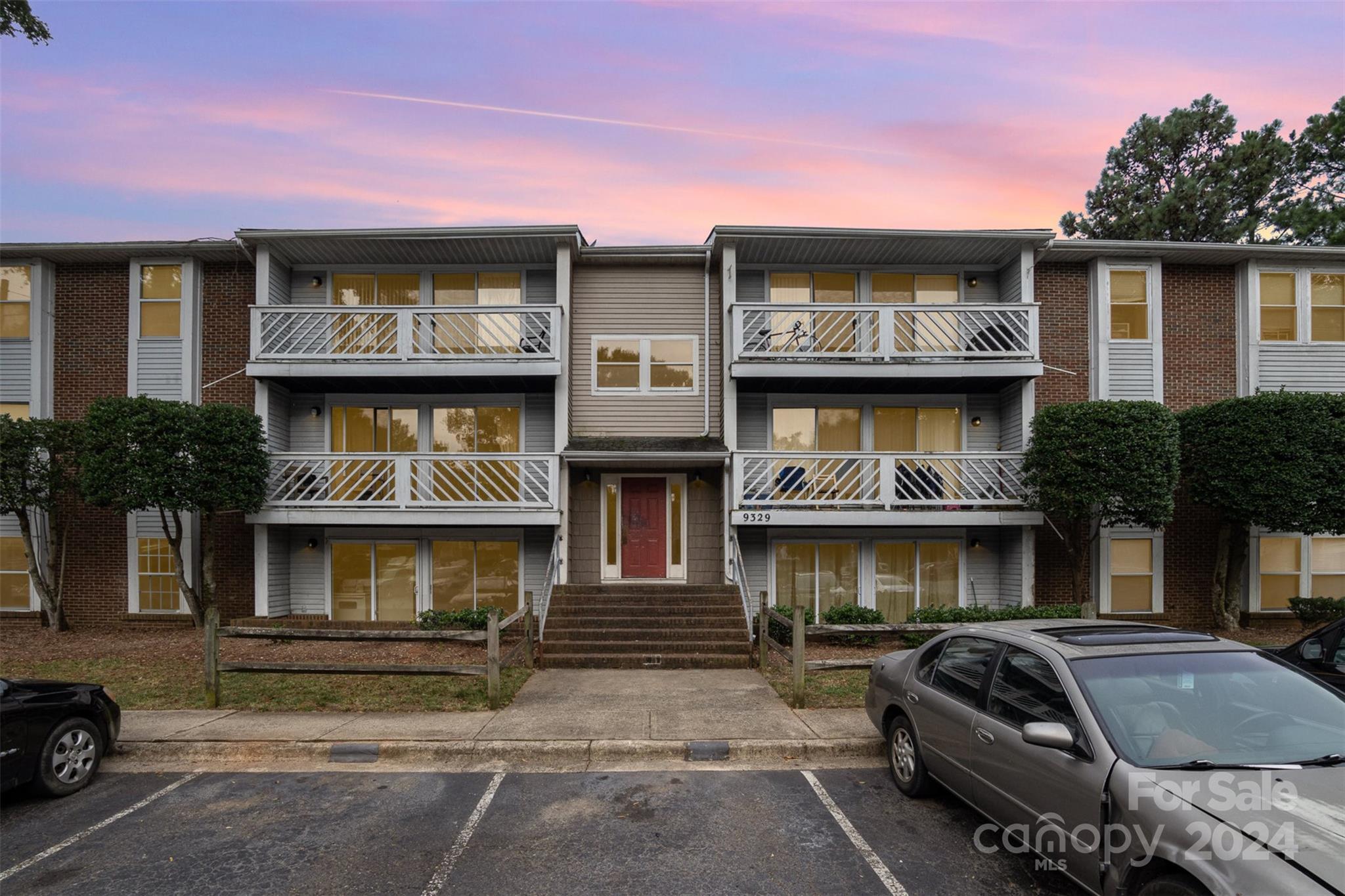 a front view of a house with parking space