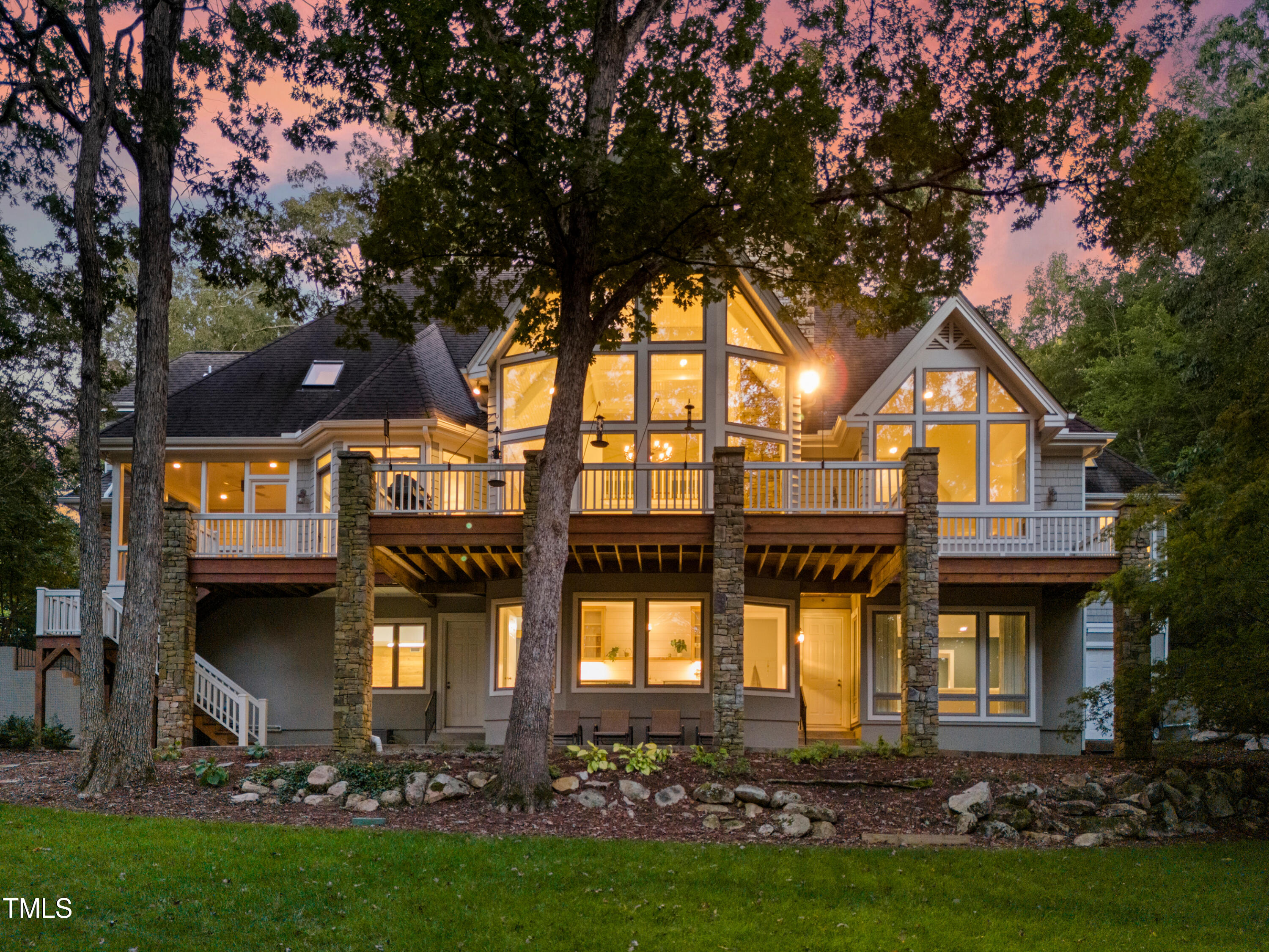 a front view of house and yard with green space