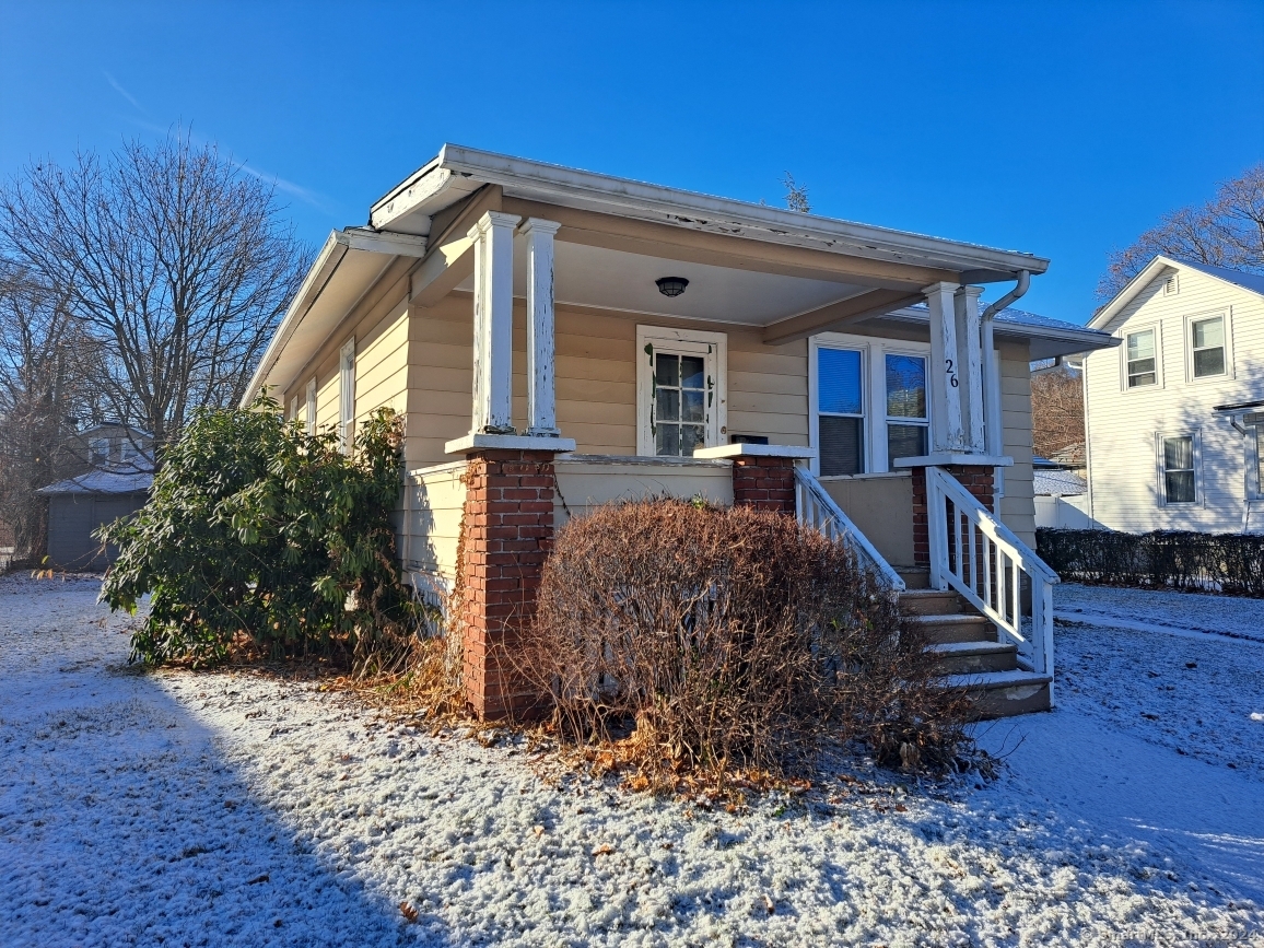 a view of a house with wooden stairs