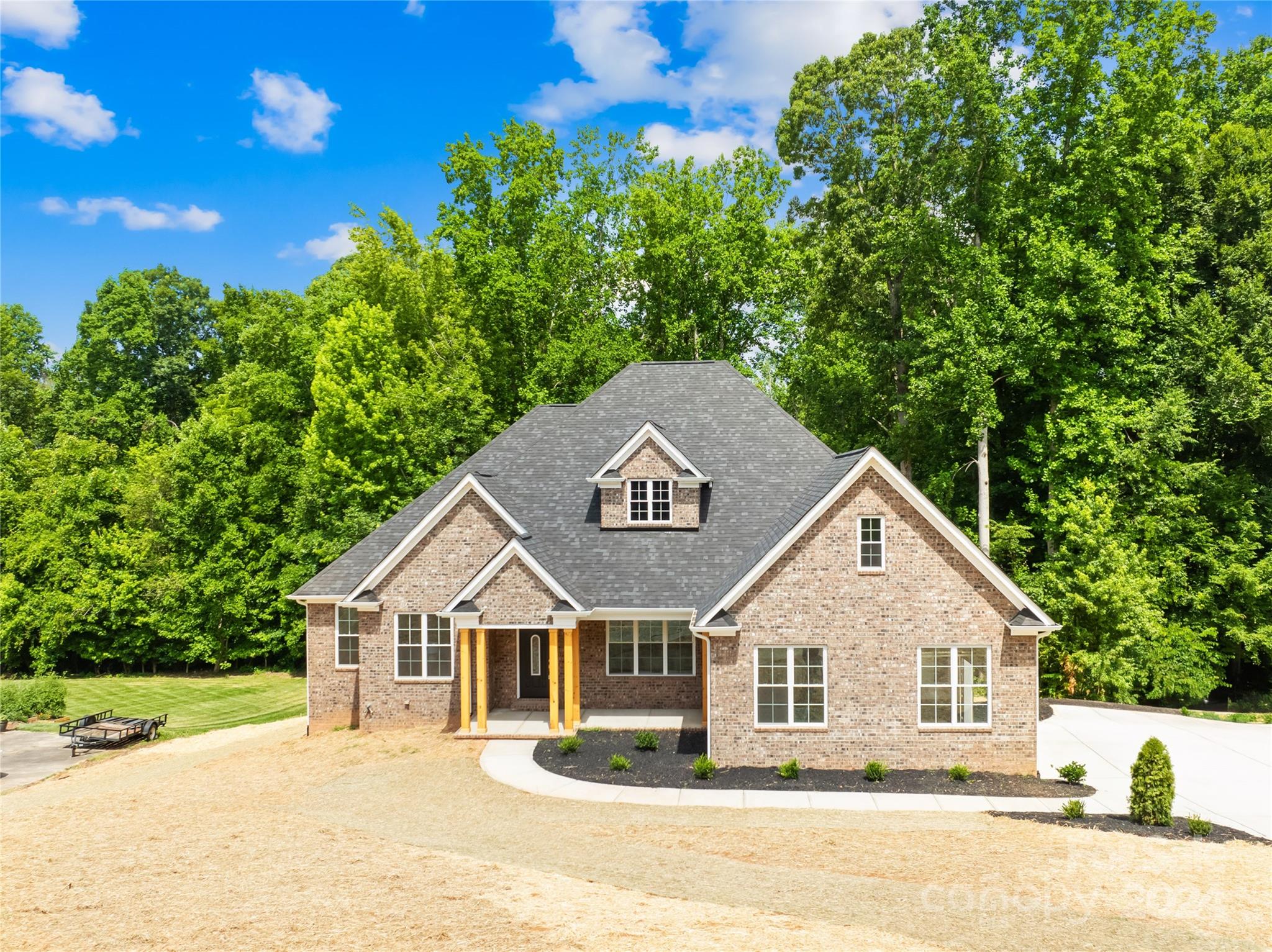 a front view of a house with a yard