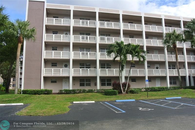 a view of a building with a yard