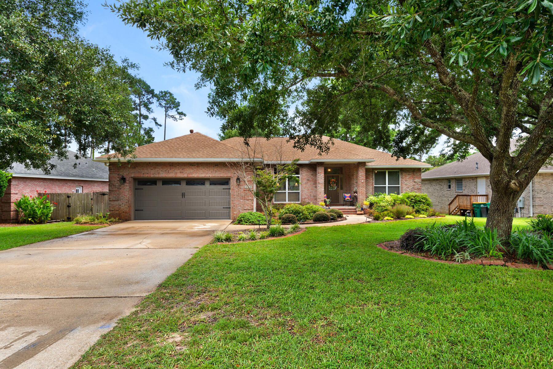 a front view of a house with a garden and porch