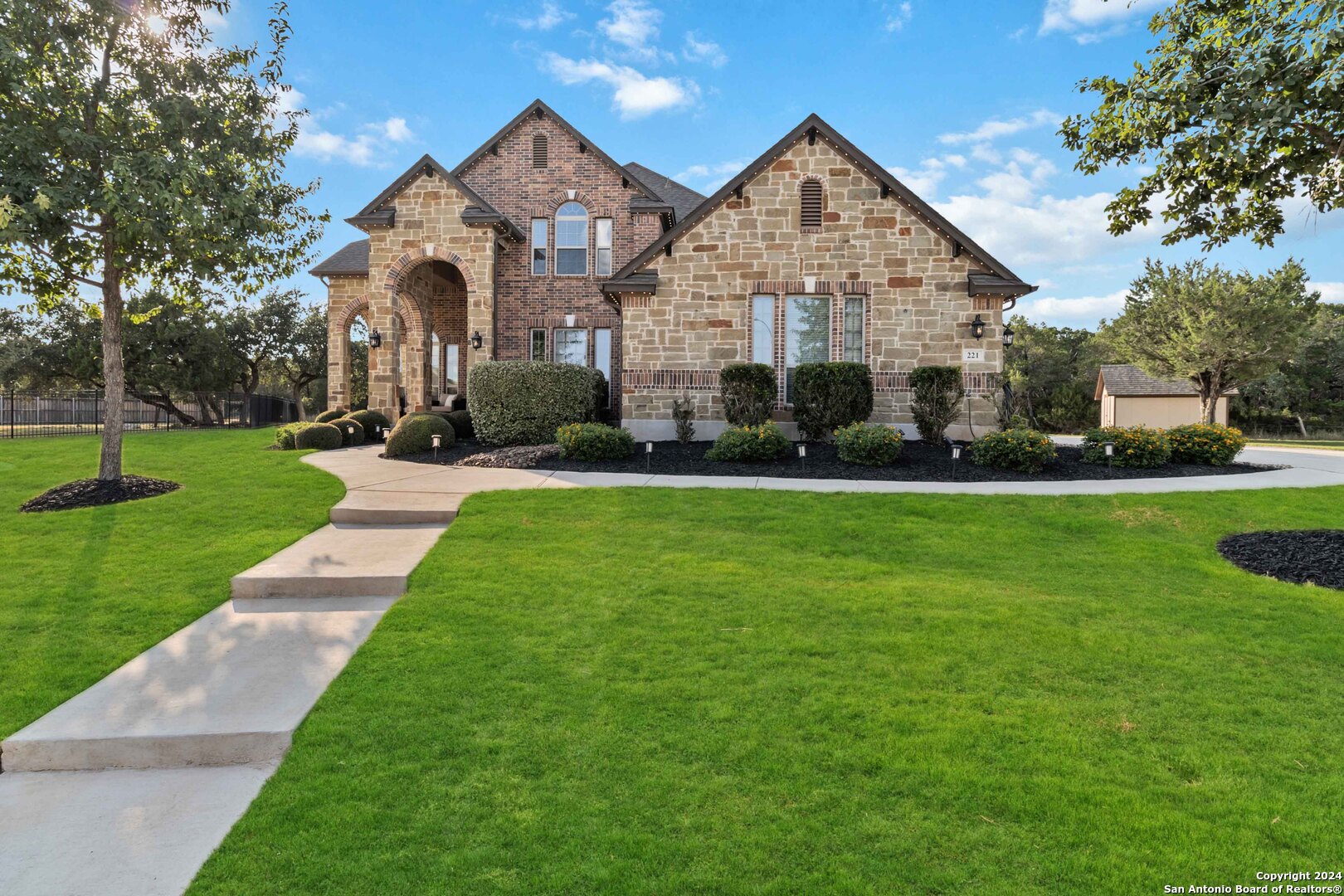 a front view of a house with a yard