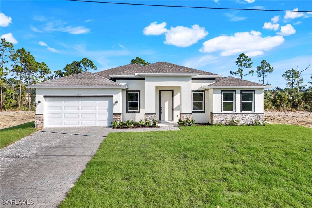 a front view of a house with a yard