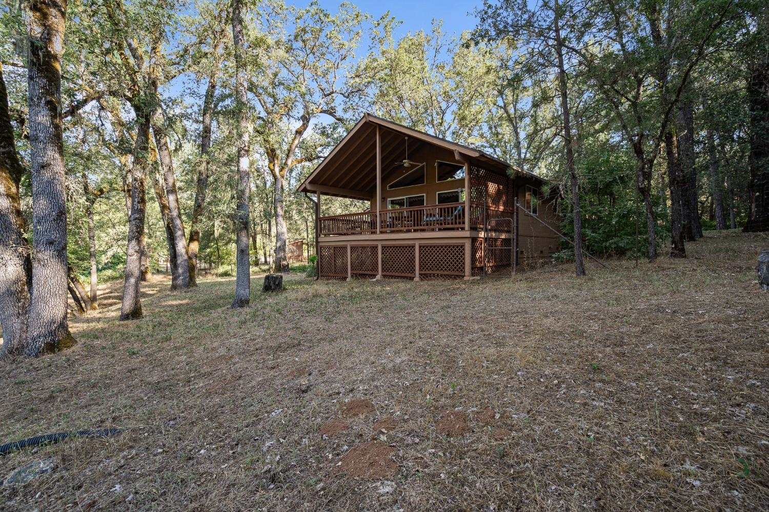 a view of house with trees in the background