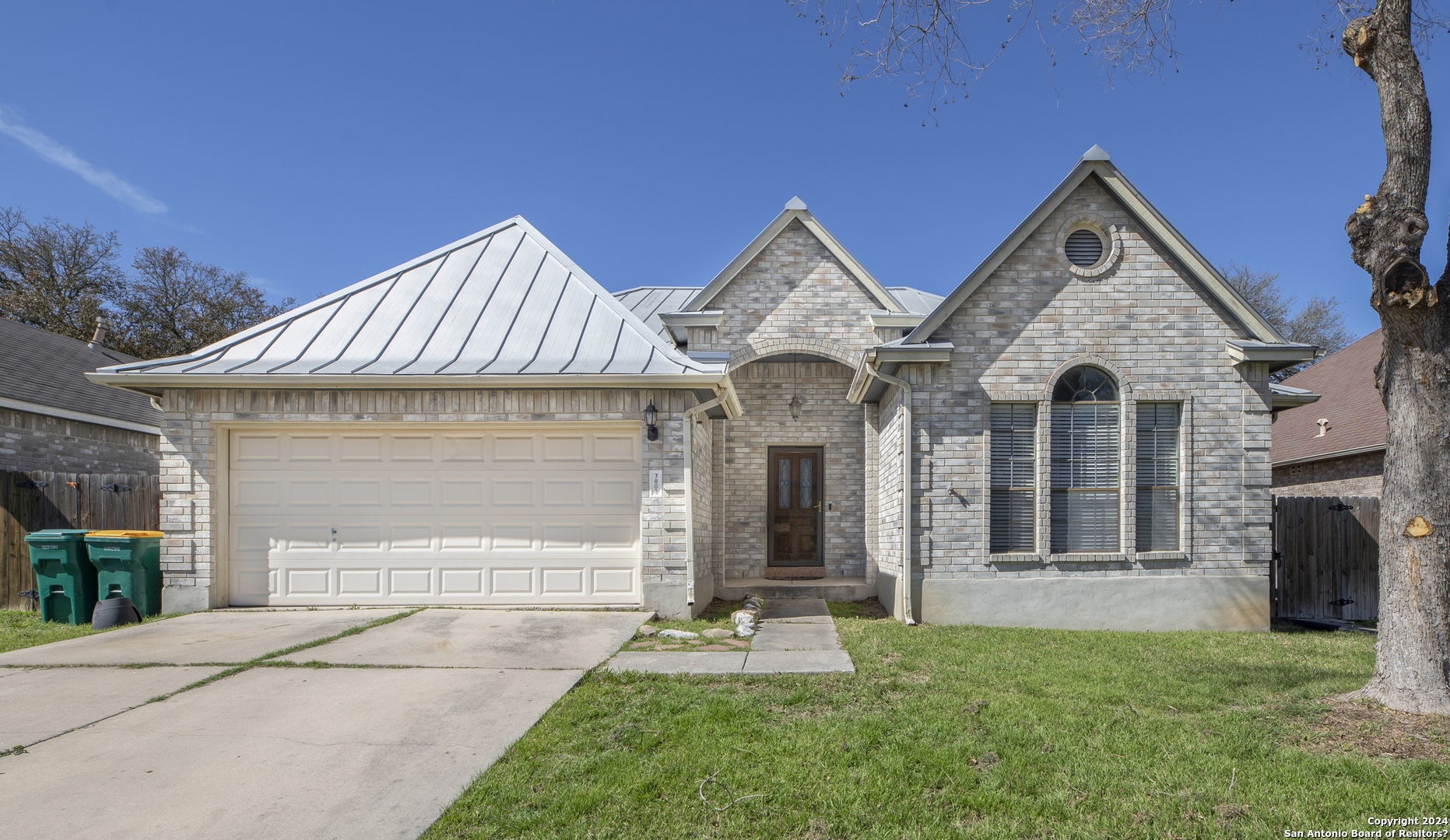 a front view of a house with garage