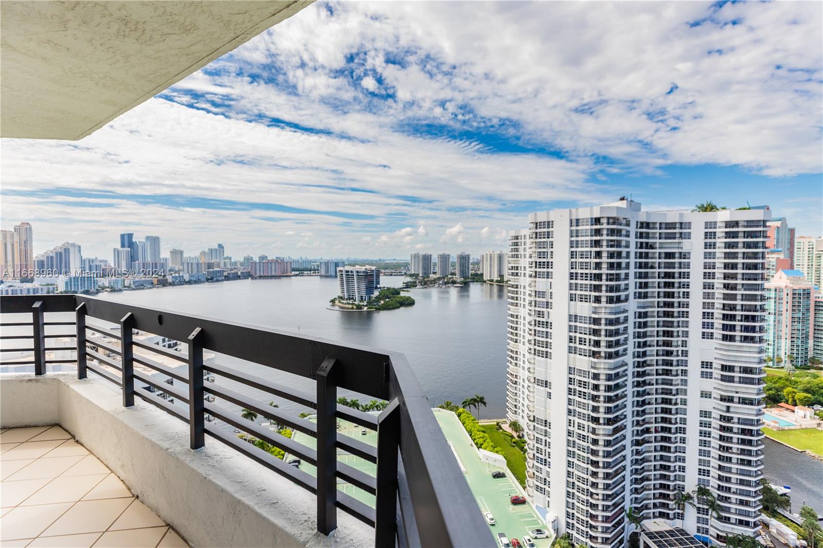 a view of city from balcony with seating space