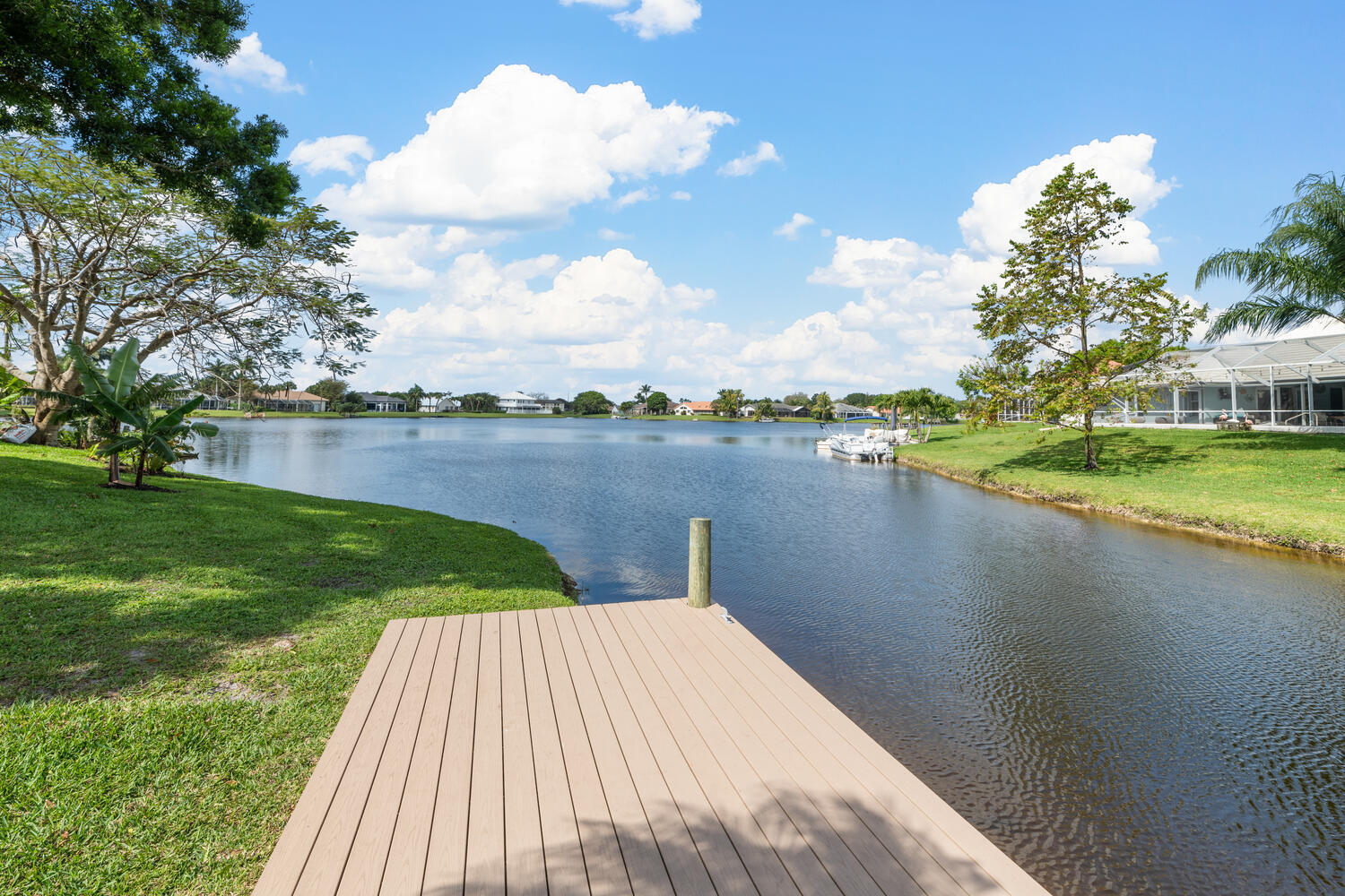 a view of a lake with houses in the back