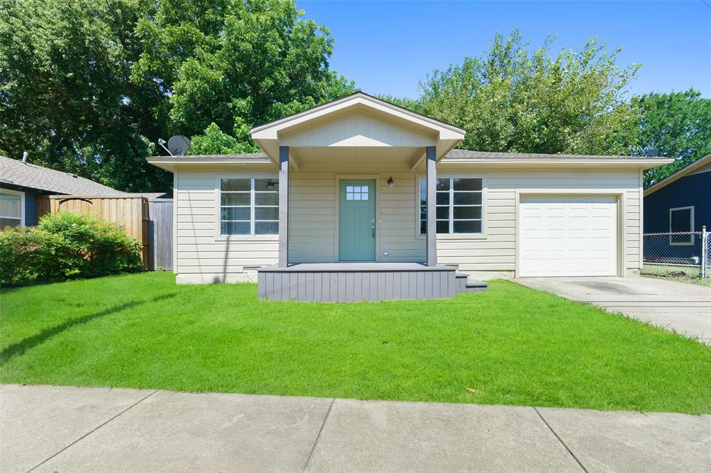 front view of a house with a yard