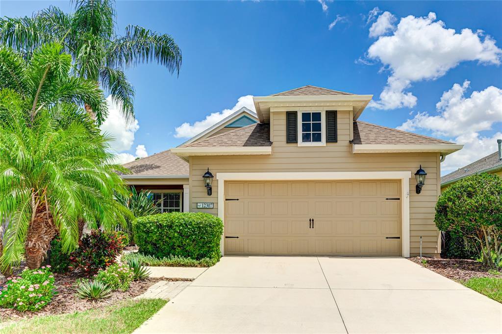 a front view of a house with a garage