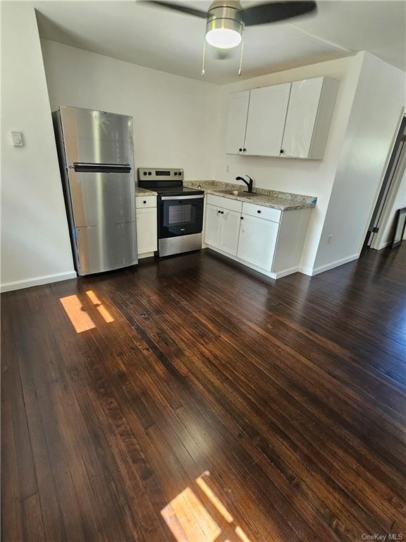 a kitchen with stainless steel appliances a refrigerator sink and stove