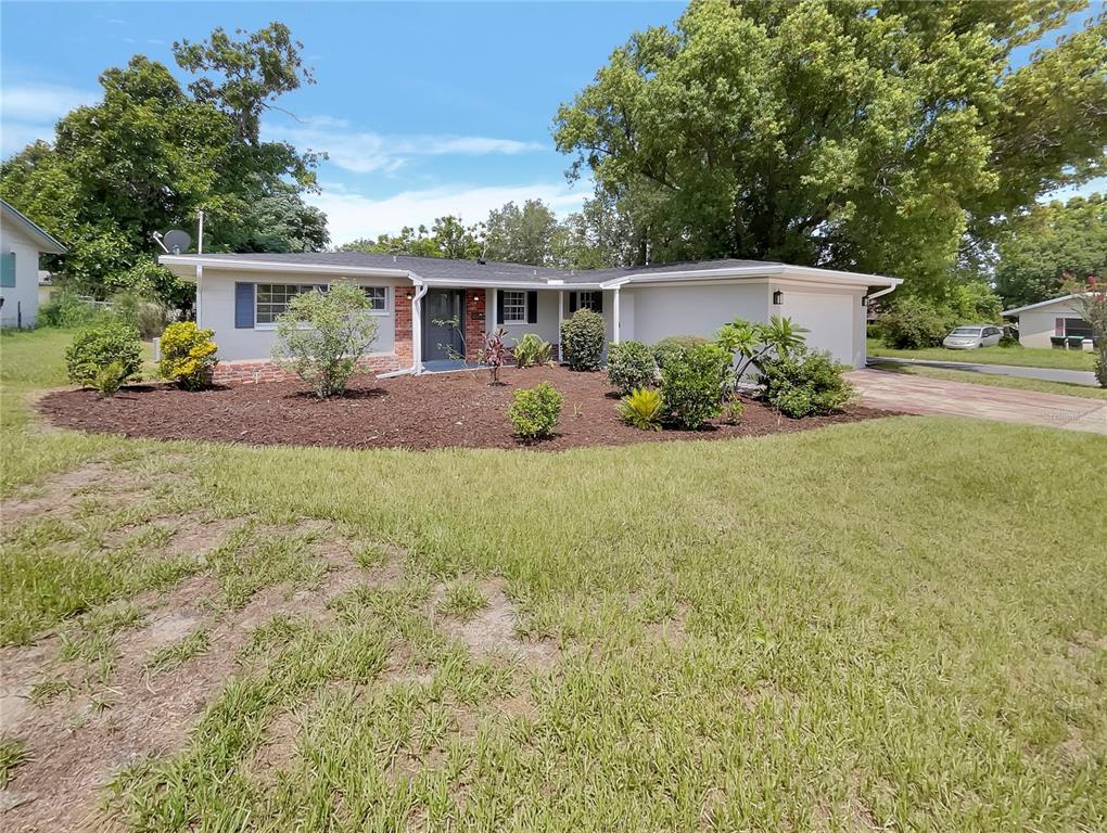 front view of a house with a yard