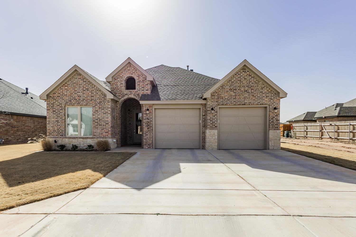 a front view of a house with a garage