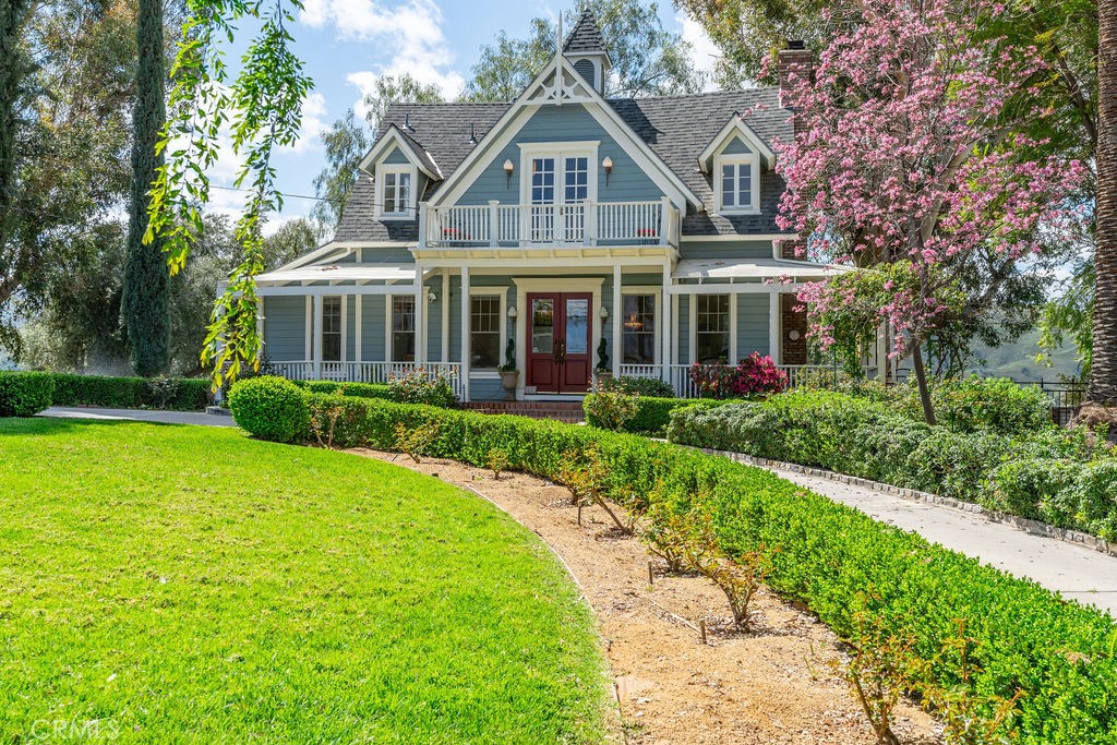 a front view of house with yard and green space