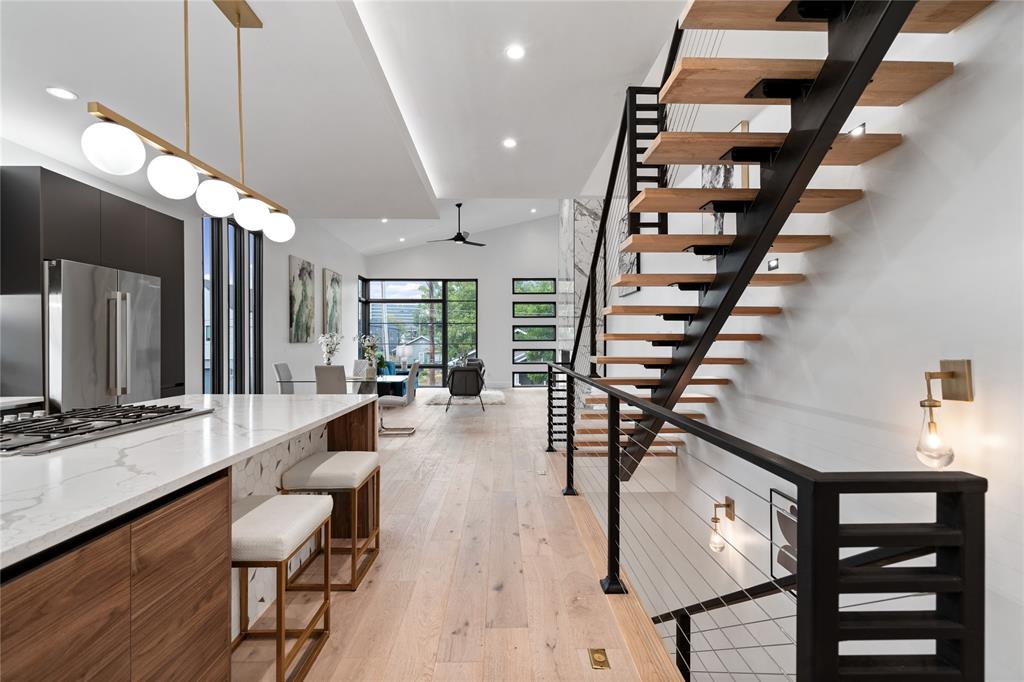 a view of a living room and entryway with wooden floor