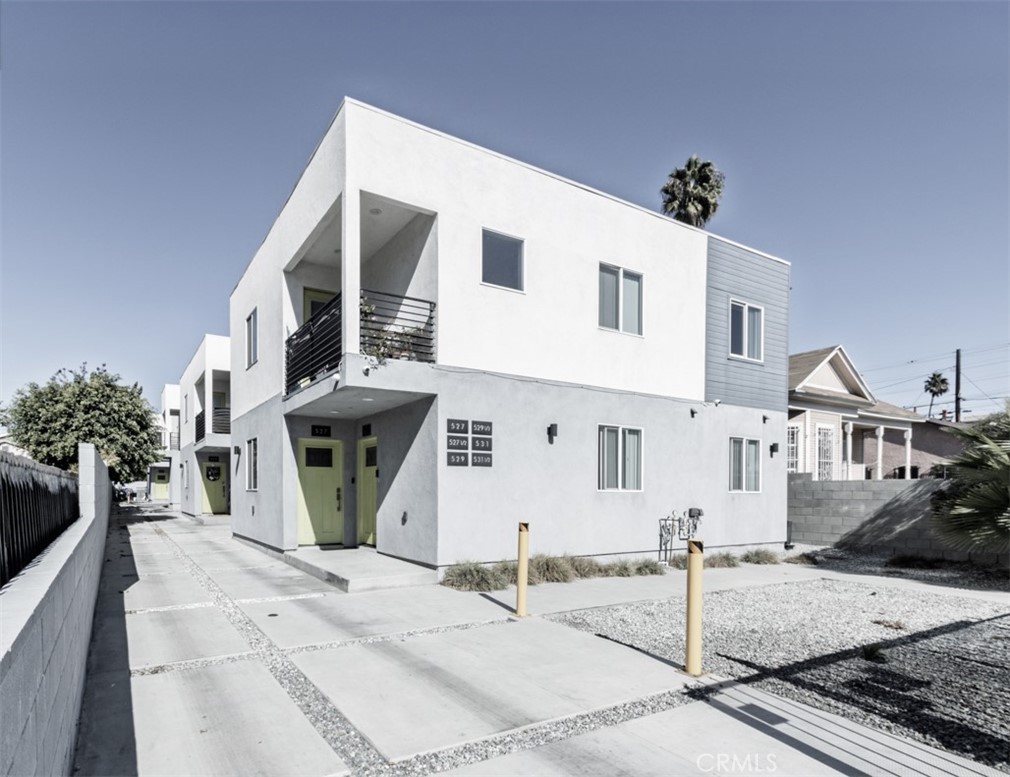 a front view of a house with garage