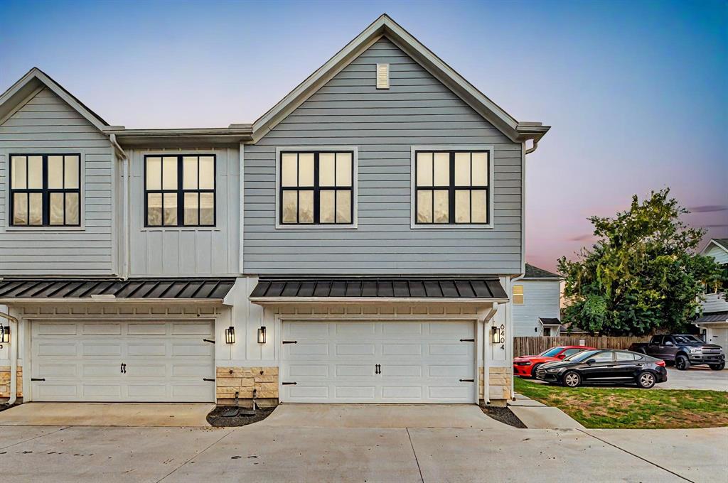 a view of a house with a parking space and a garage