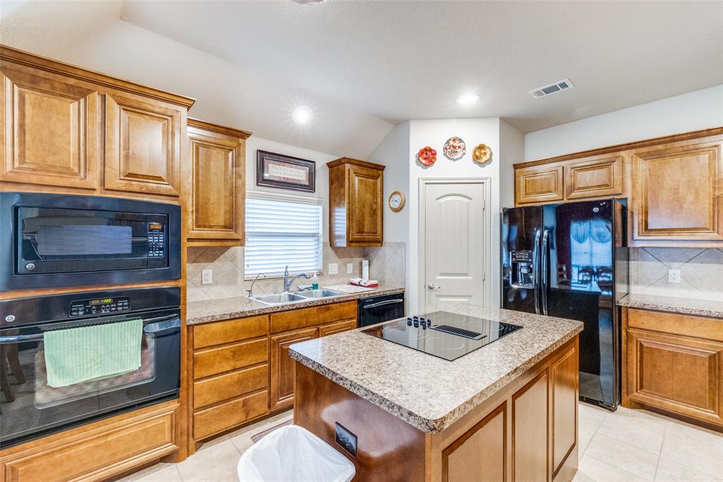 a kitchen with stainless steel appliances granite countertop a stove and a sink