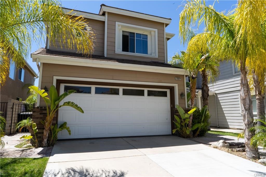 a front view of a house with a garage