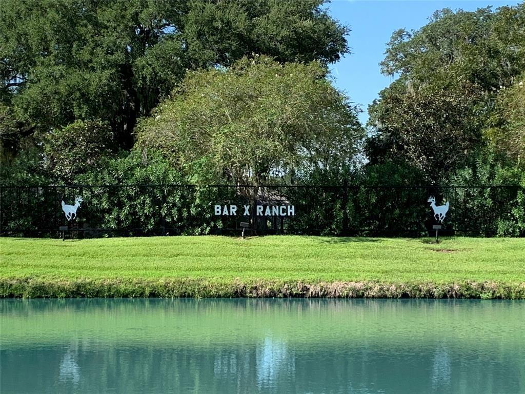 a view of a lake with a big yard