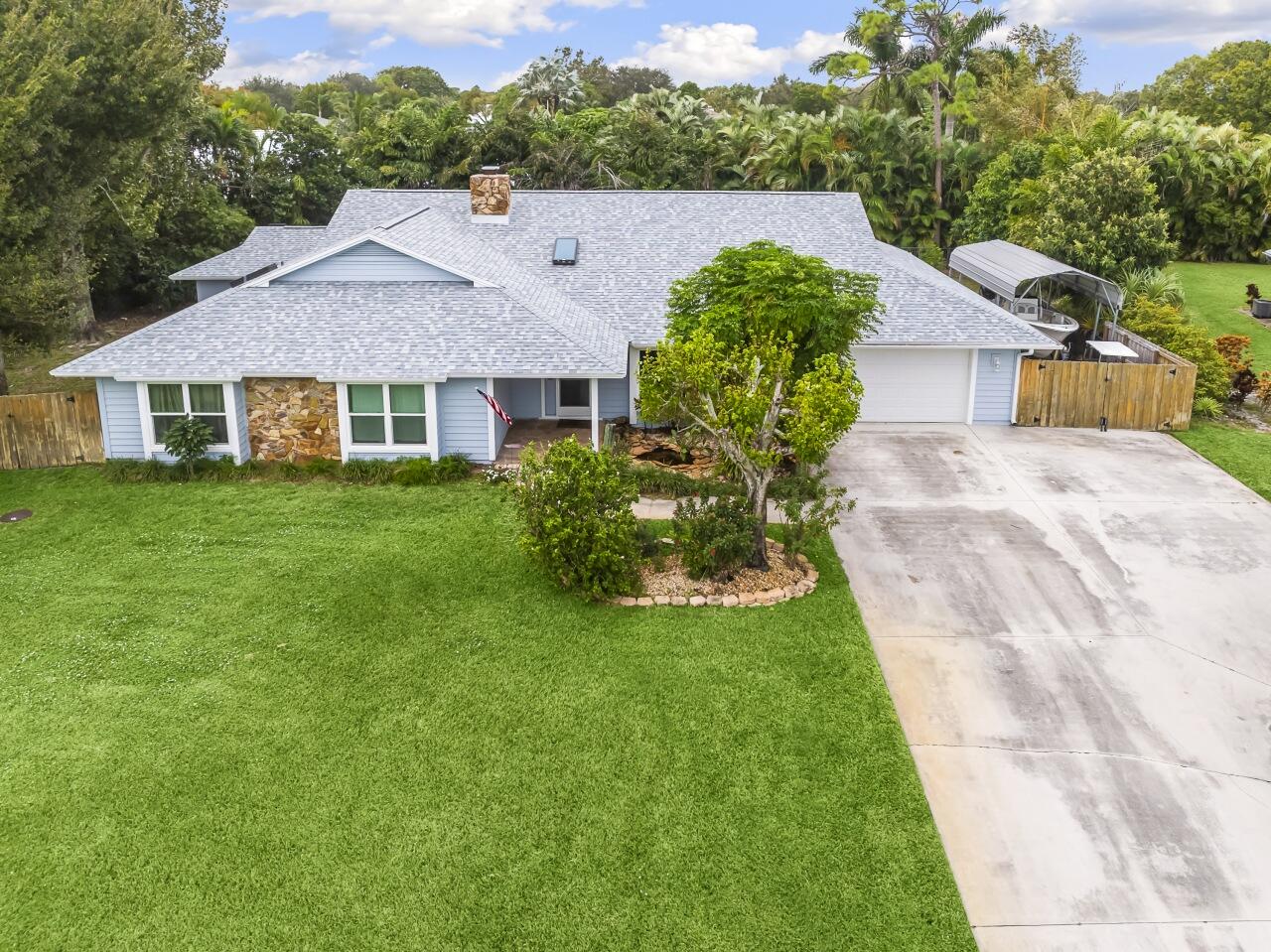 a aerial view of a house with a yard