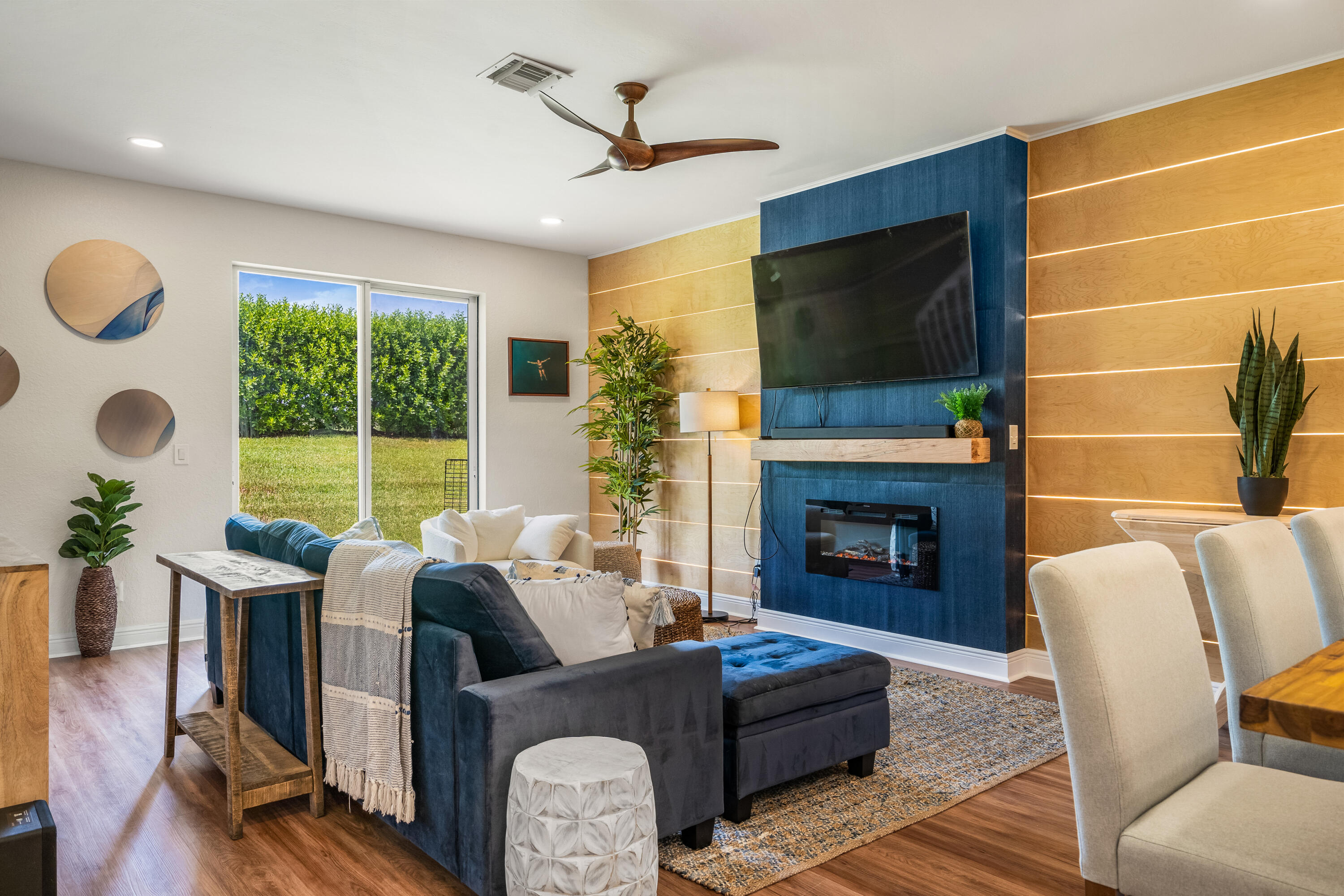 a living room with furniture fireplace and a flat screen tv