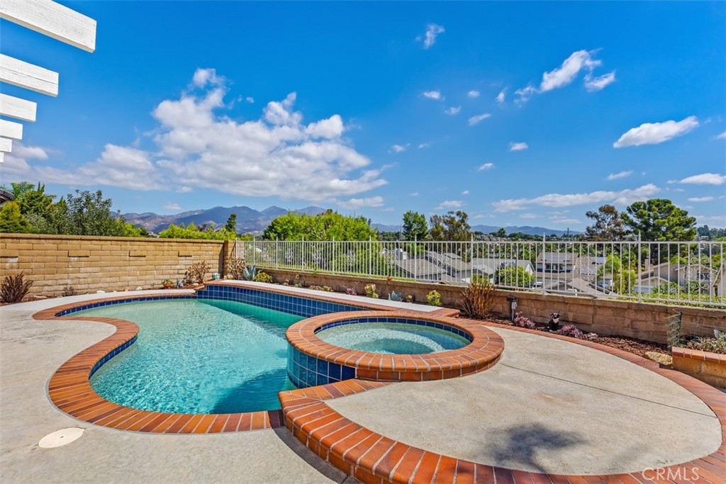 a view of swimming pool having outdoor seating