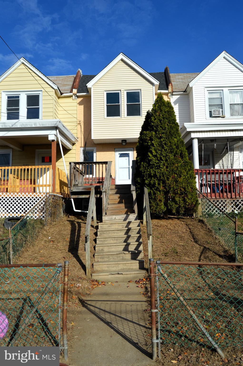 a view of a house with entrance gate