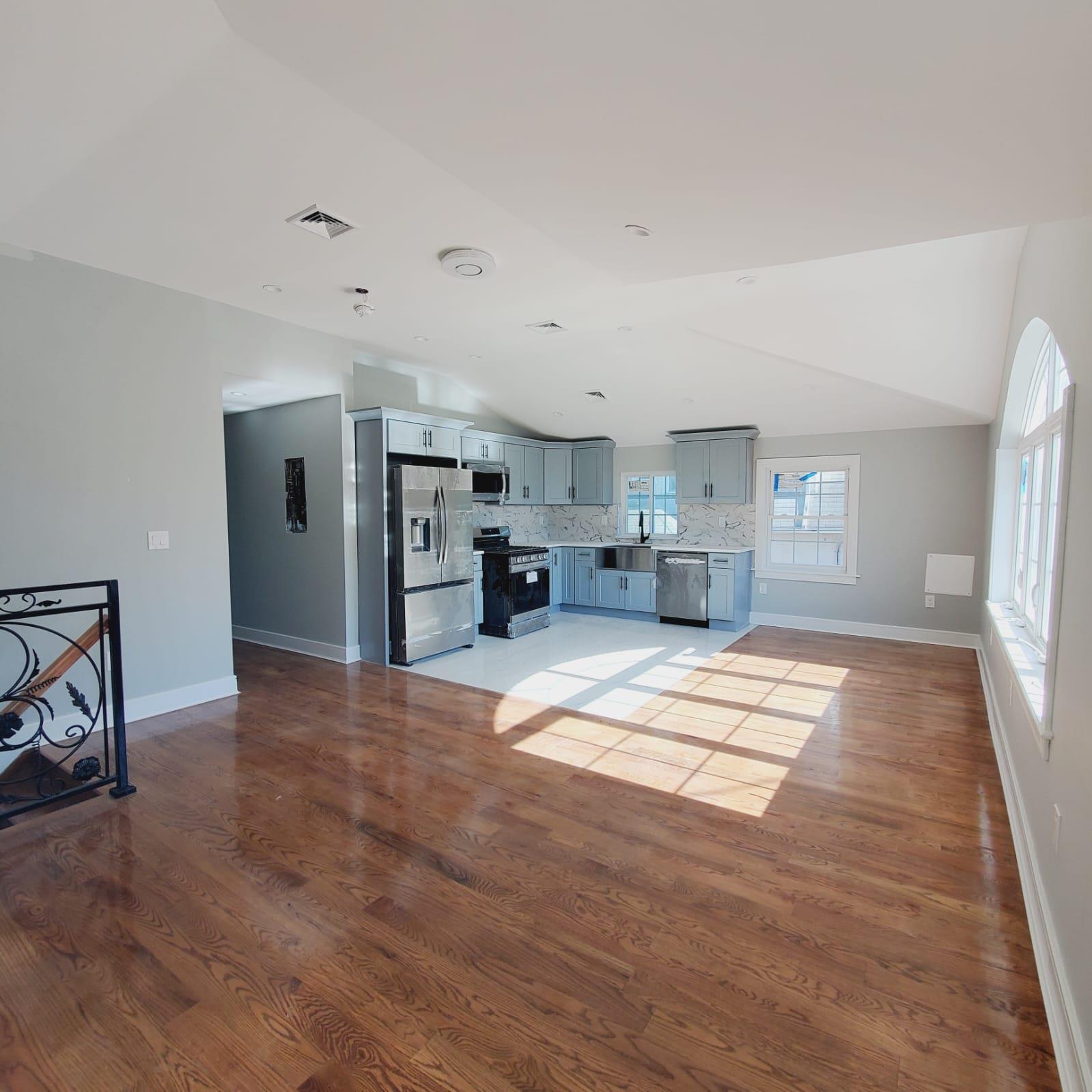 a view of kitchen and refrigerator cabinets