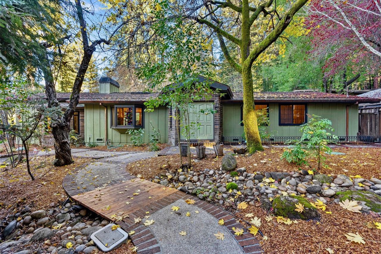 a front view of a house with garden