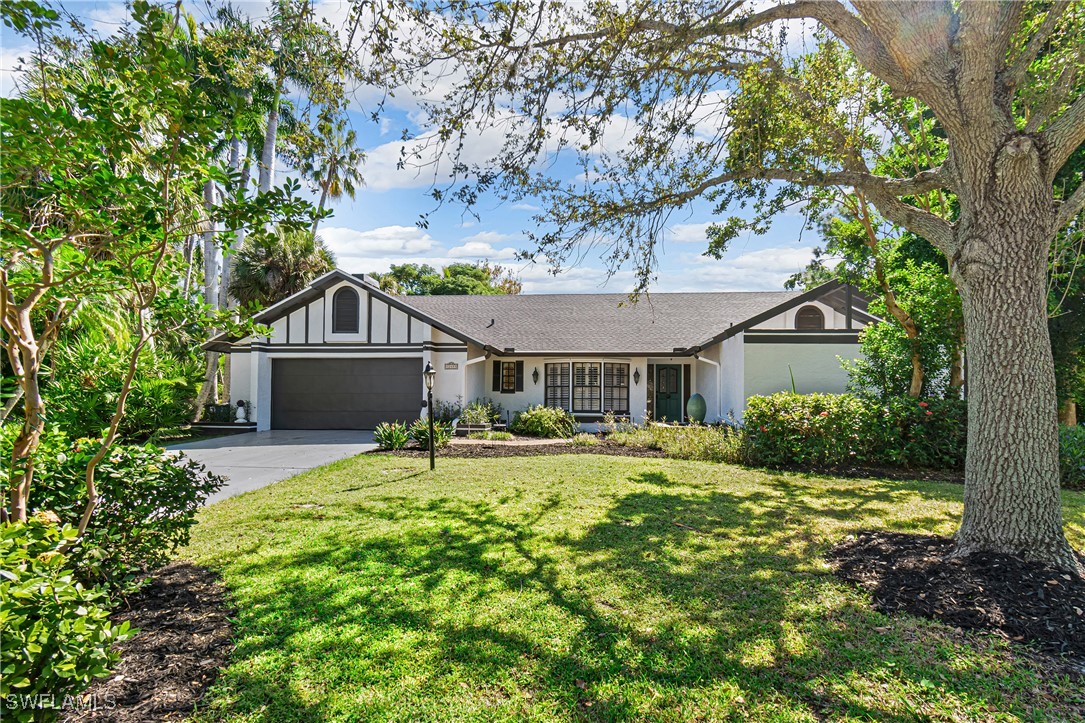 a house view with a sitting space and garden