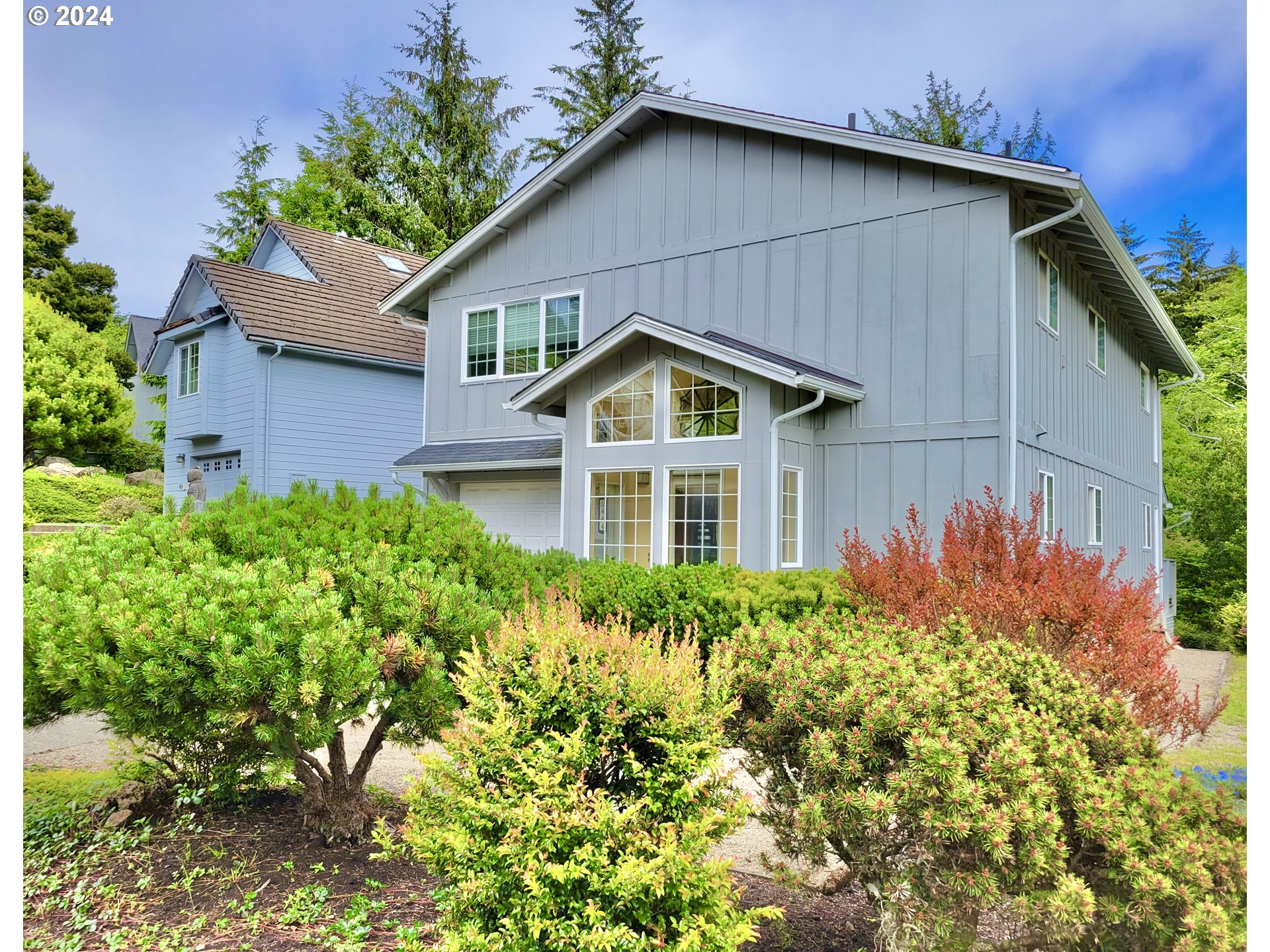 a front view of a house with a yard