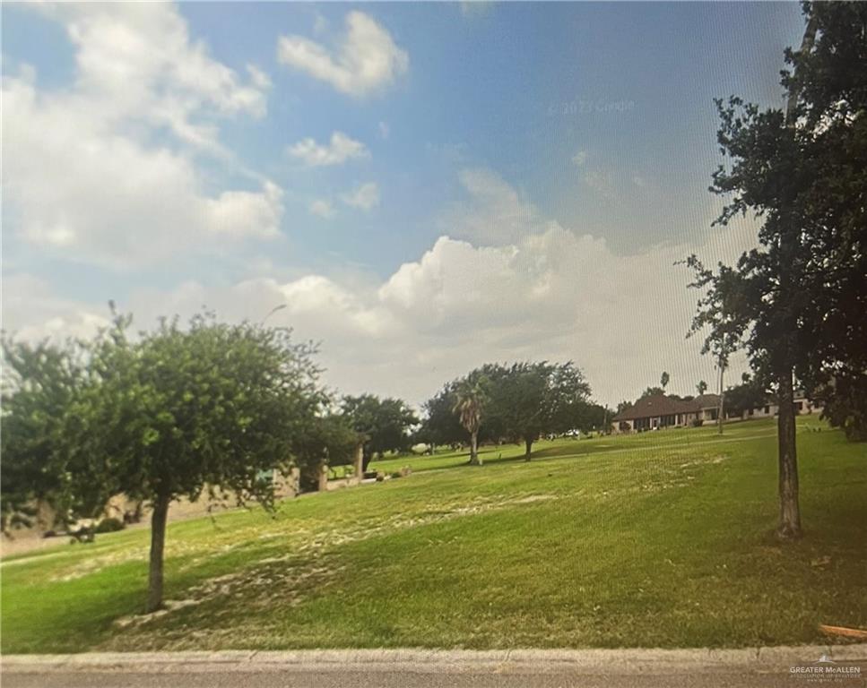 a view of a golf course with a lake