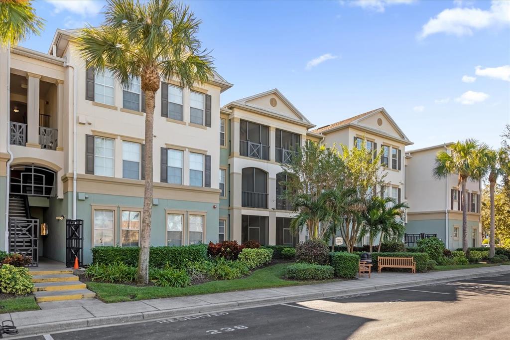 a front view of a residential apartment building with a yard