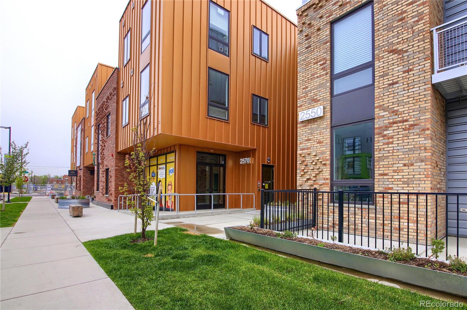 a view of a building with a yard