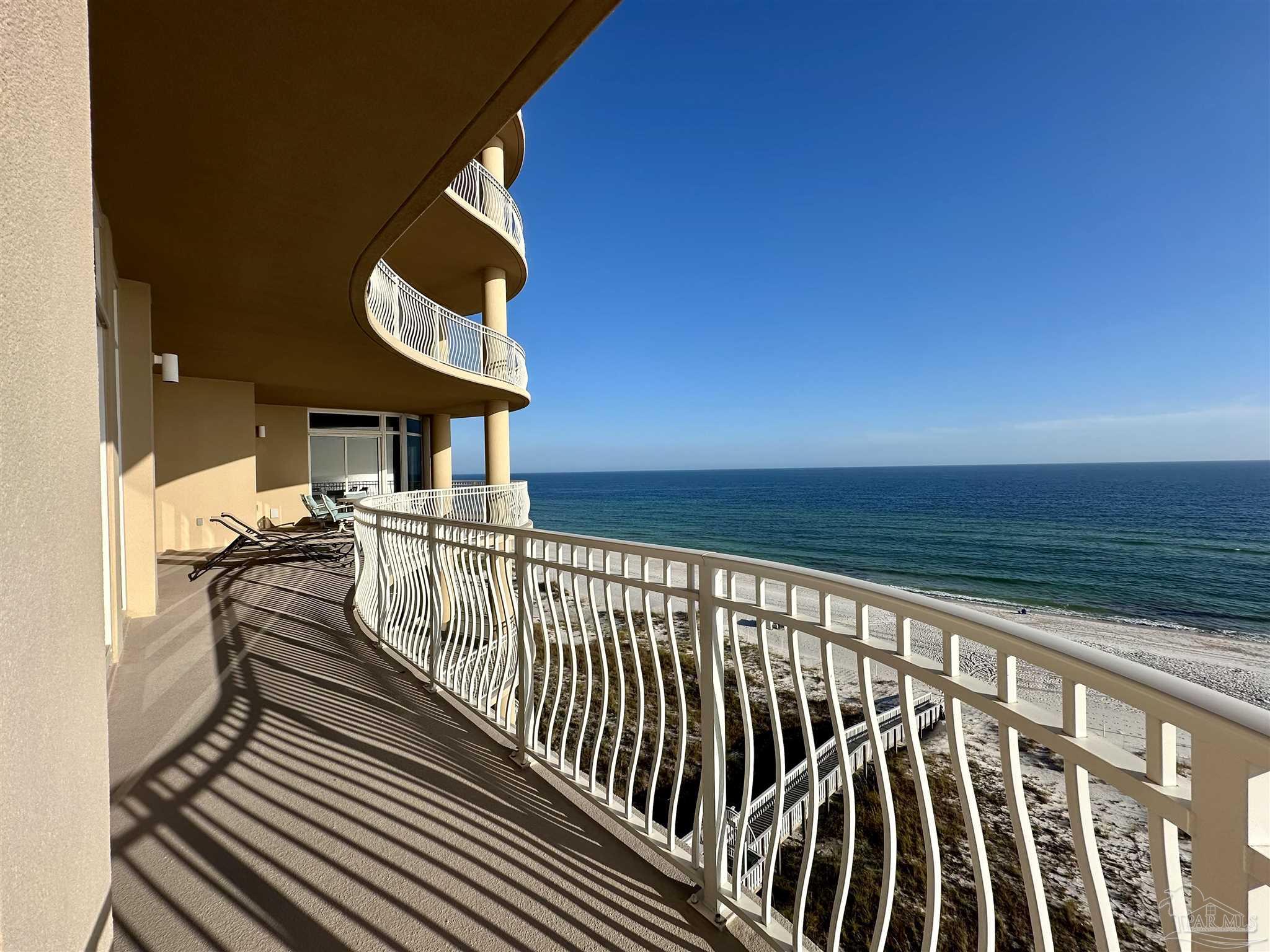 a view of balcony with furniture