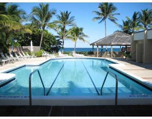 a view of swimming pool with a patio