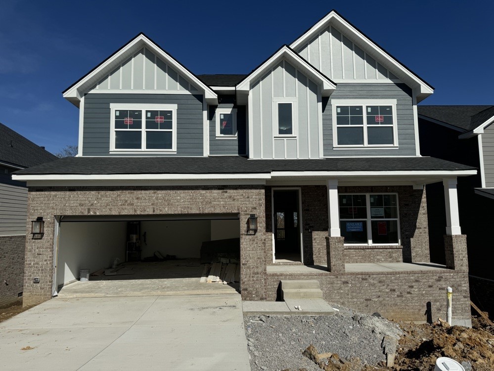 a front view of a house with yard and seating space