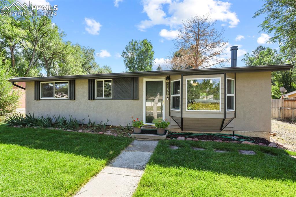 a front view of a house with a yard