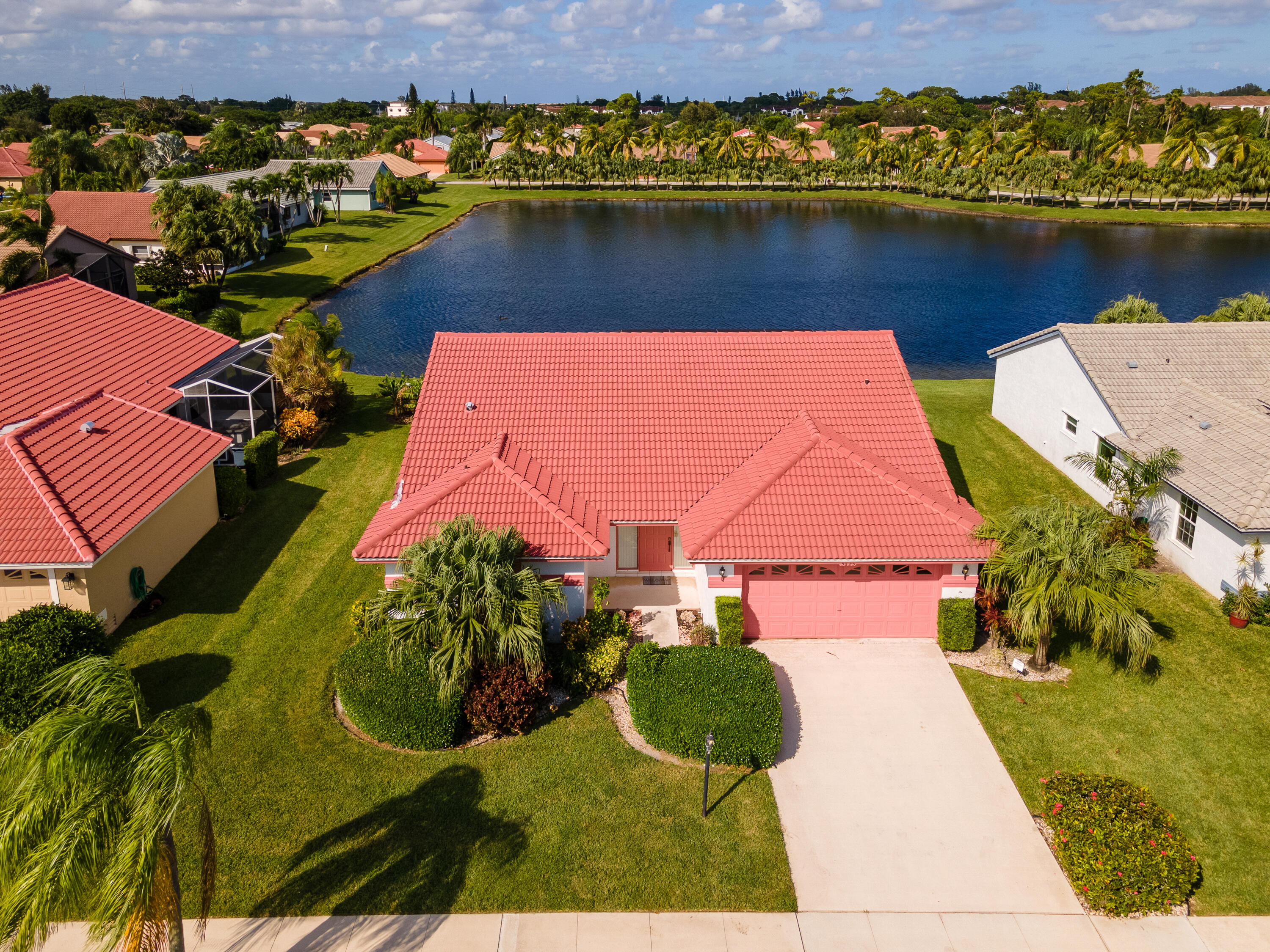 an aerial view of a house with a lake view