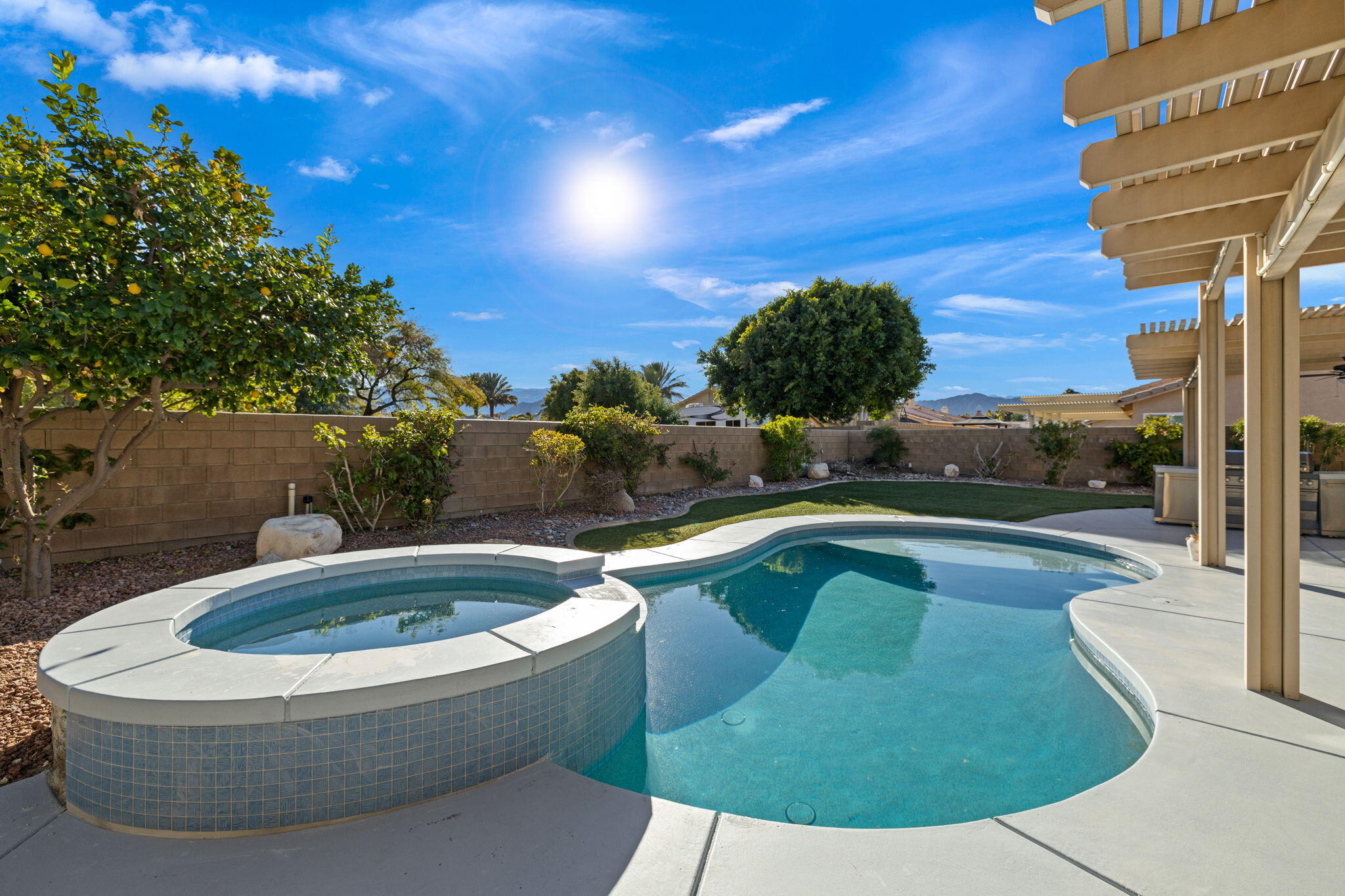 a view of swimming pool having outdoor seating